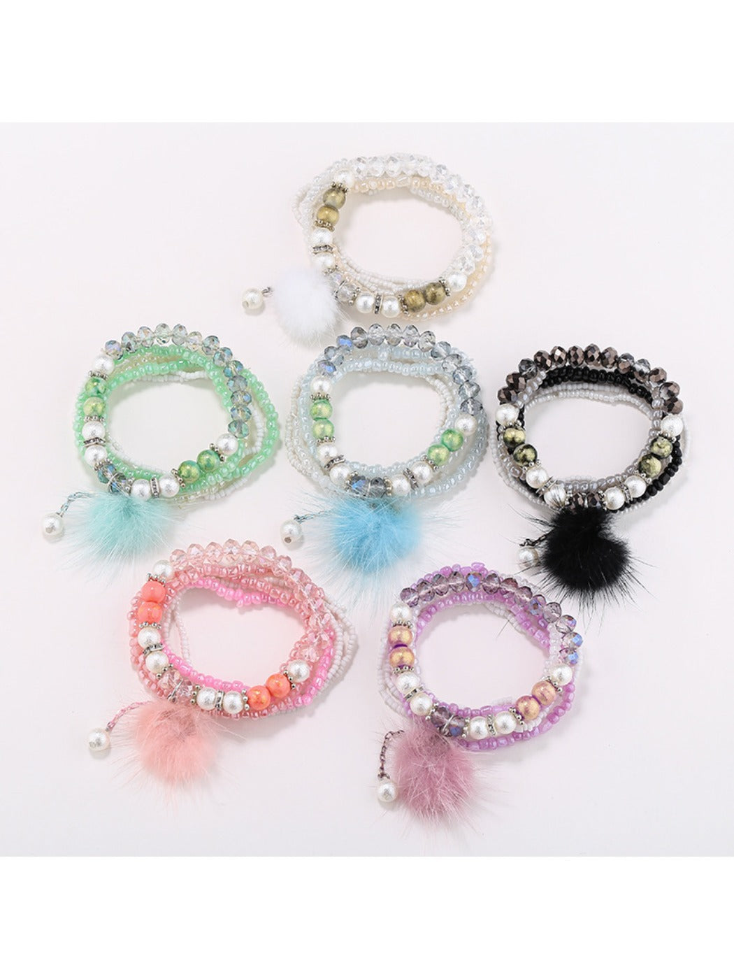Lovra pompom pendant beaded bracelet with colorful beads and a pink pompom charm