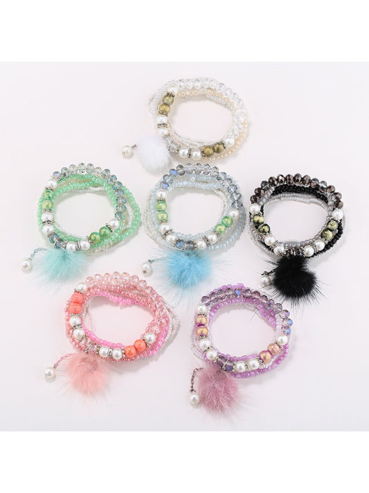 Lovra pompom pendant beaded bracelet with colorful beads and a pink pompom charm