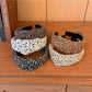 Close-up of wide vintage print headband fabric pattern with floral design