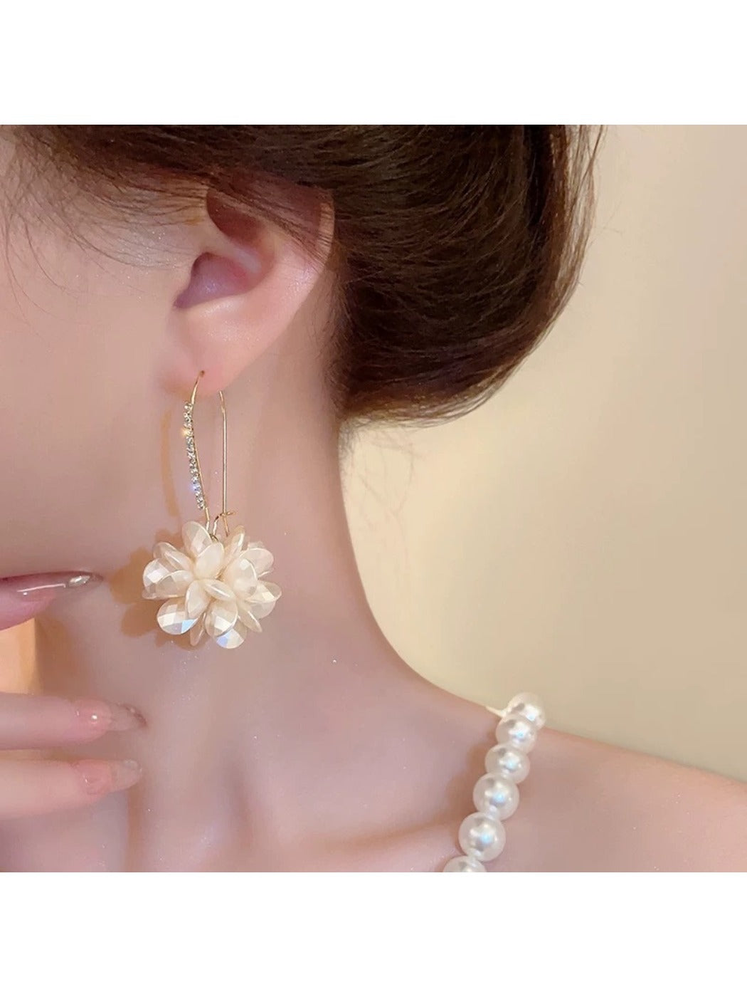 Pair of Hydrangea shaped drop earrings displayed on a white background