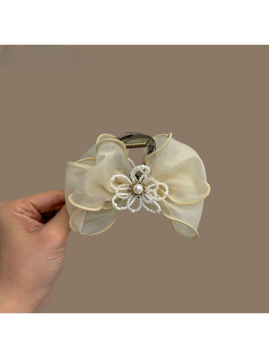 Beau bow hair claw clip worn in styled hair, showcasing size and fit