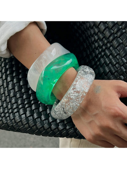 Lovra bangle bracelet worn on wrist showcasing its modern, asymmetrical design