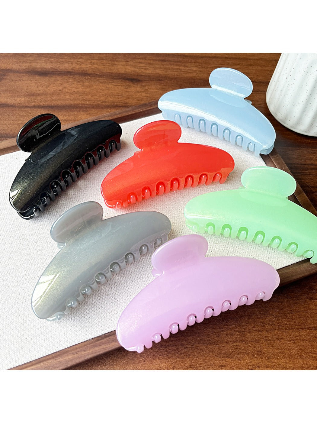 Close-up of Beau half round hair clip showing smooth matte black finish