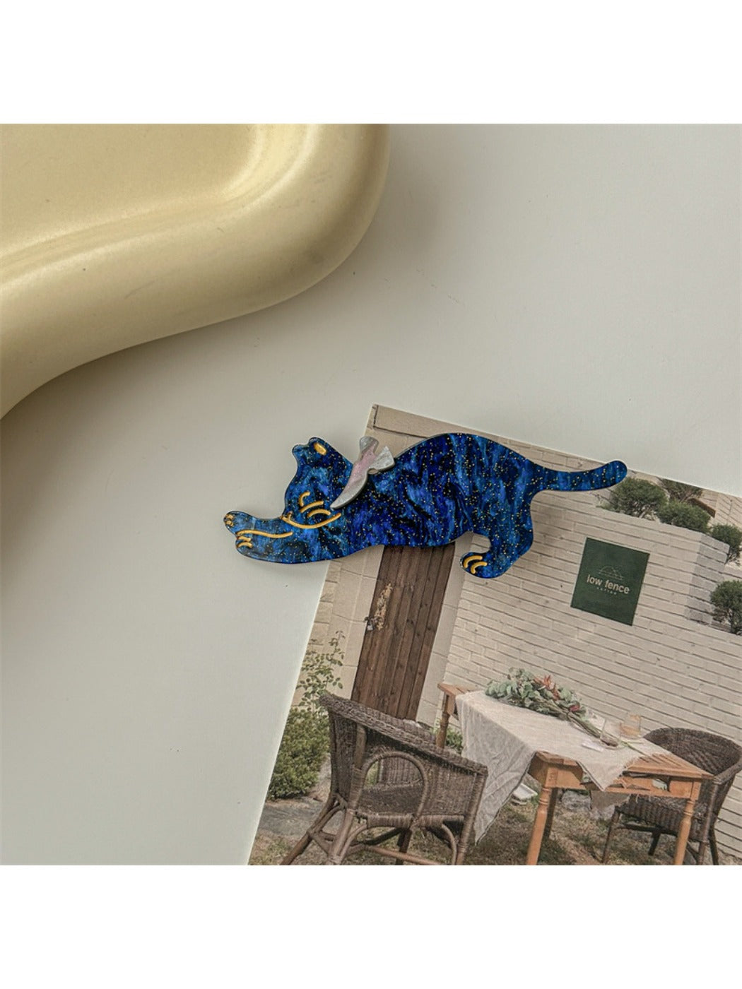 Beau hair clip featuring a smiling cat face with whiskers