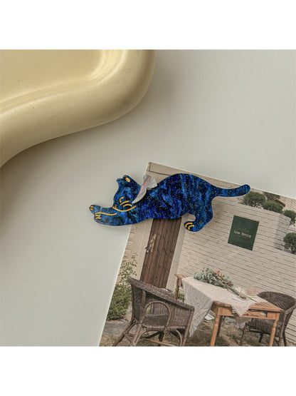 Beau hair clip featuring a smiling cat face with whiskers