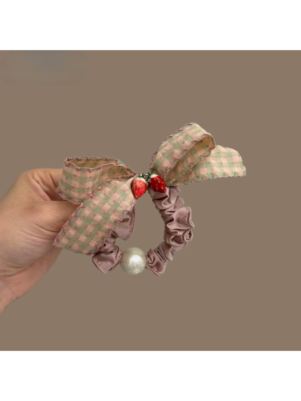 Close-up of Gifty Sweet Plaid Bow Scrunchie in red and white pattern