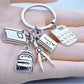 Alloy backpack-shaped keychain with book design on a white background