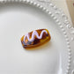 Beau hair clip displayed with matching accessories on table