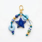 Vintage beaded keychain displayed on a white background highlighting colors and texture