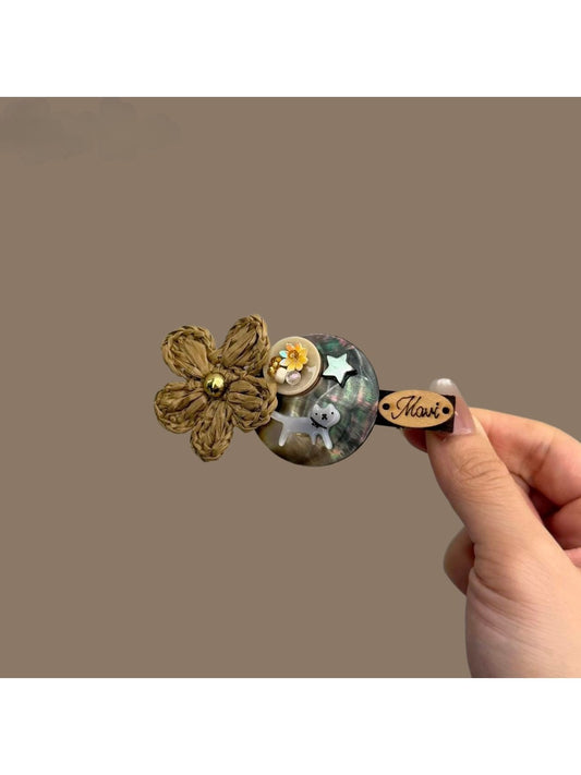 Beau hair clip with pastel floral pattern and gold-tone metal clip base