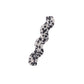 Beau hair clip positioned on wooden surface showing shape and size