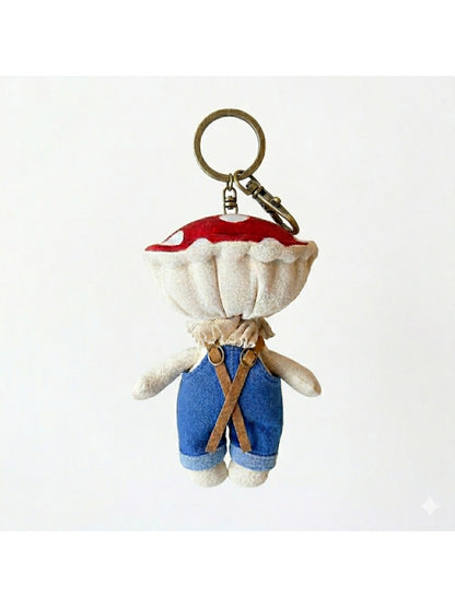 Keypus fabric doll keychain displayed on a wooden surface with soft lighting