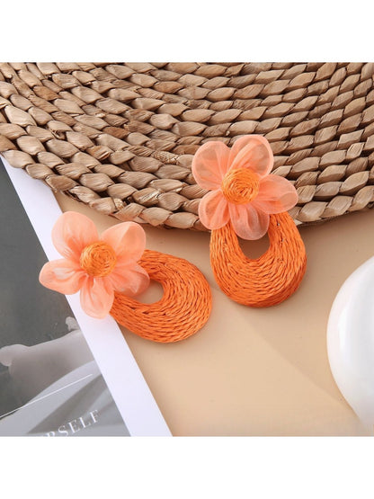 Sweet Raffia Flower Shaped Stud Earrings arranged with natural raffia fibers