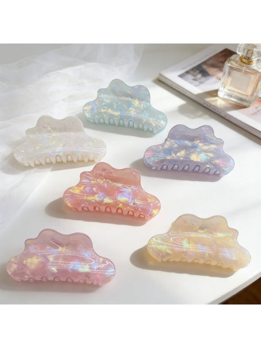 Close-up of Beau holographic mermaid claw clip with iridescent finish