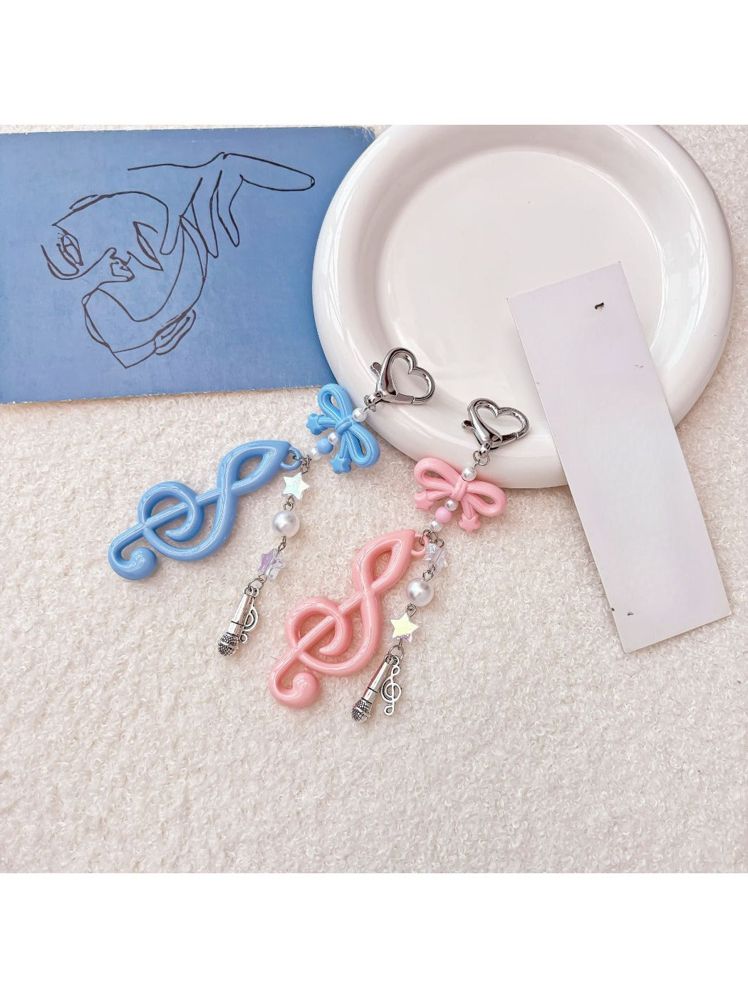 Side view of Keypus music note keychain showing its thickness and design