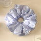 Gifty scrunchie displayed on a white background highlighting floral design