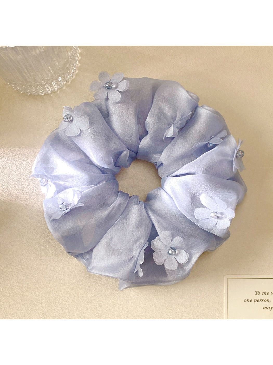 Gifty scrunchie displayed on a white background highlighting floral design