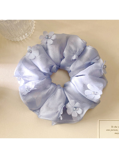 Gifty scrunchie displayed on a white background highlighting floral design