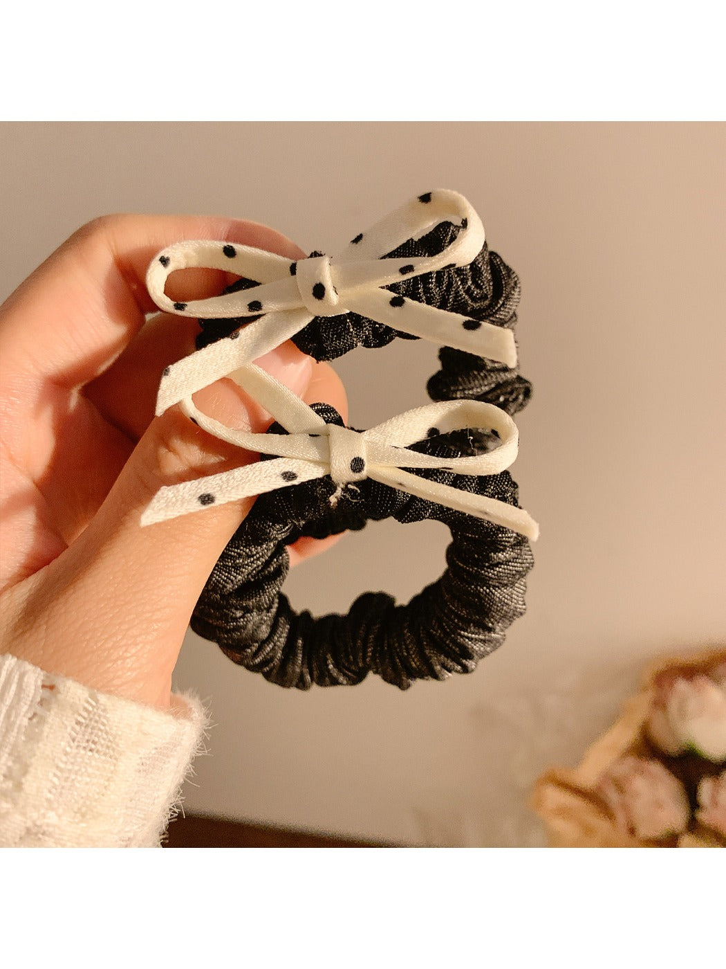 Close-up of the polka dot bow detail on the vintage style hair tie
