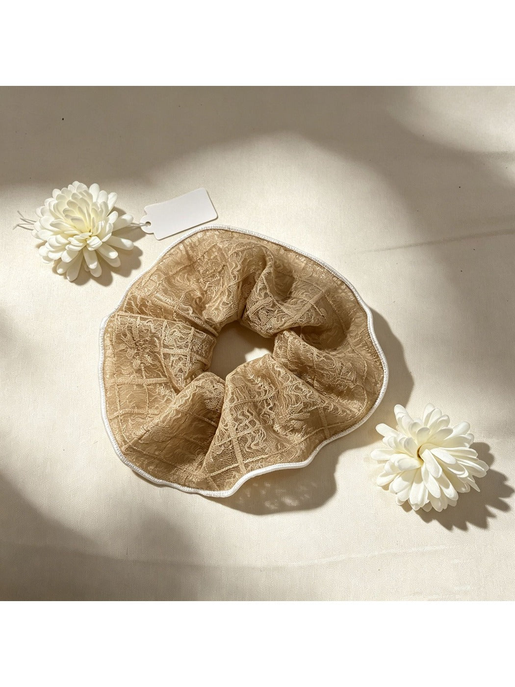 Close-up of Gifty lace scrunchie texture and delicate lace details