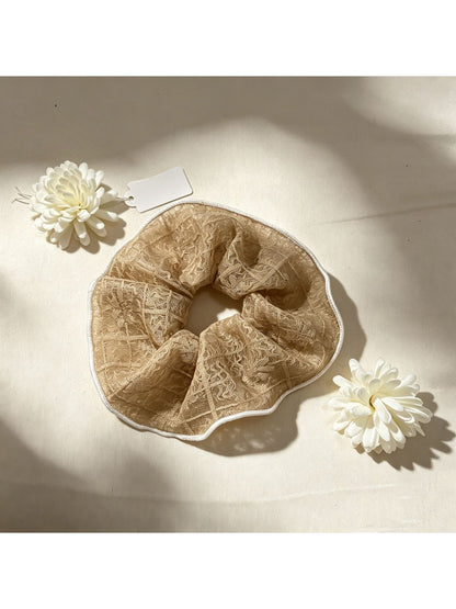 Close-up of Gifty lace scrunchie texture and delicate lace details