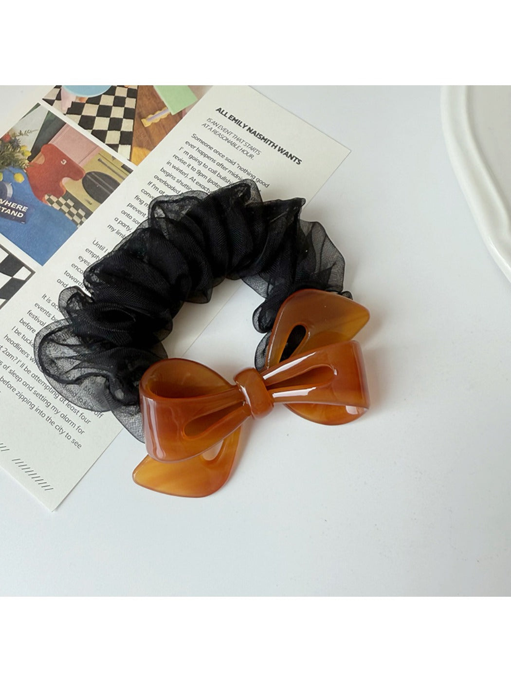 Gifty scrunchie styled in a ponytail with mesh bow accent