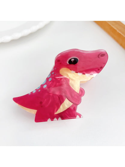 Green frog shaped hair claw clip with detailed eyes and mouth