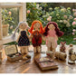 Fabric yarn doll keychain with colorful braided hair and embroidered face