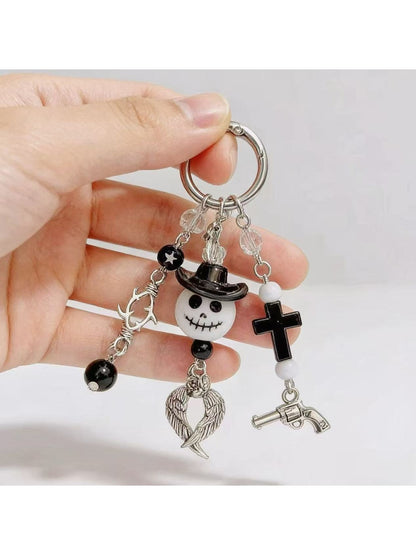 Close-up of the ghost pendant keychain showing smooth edges and matte finish