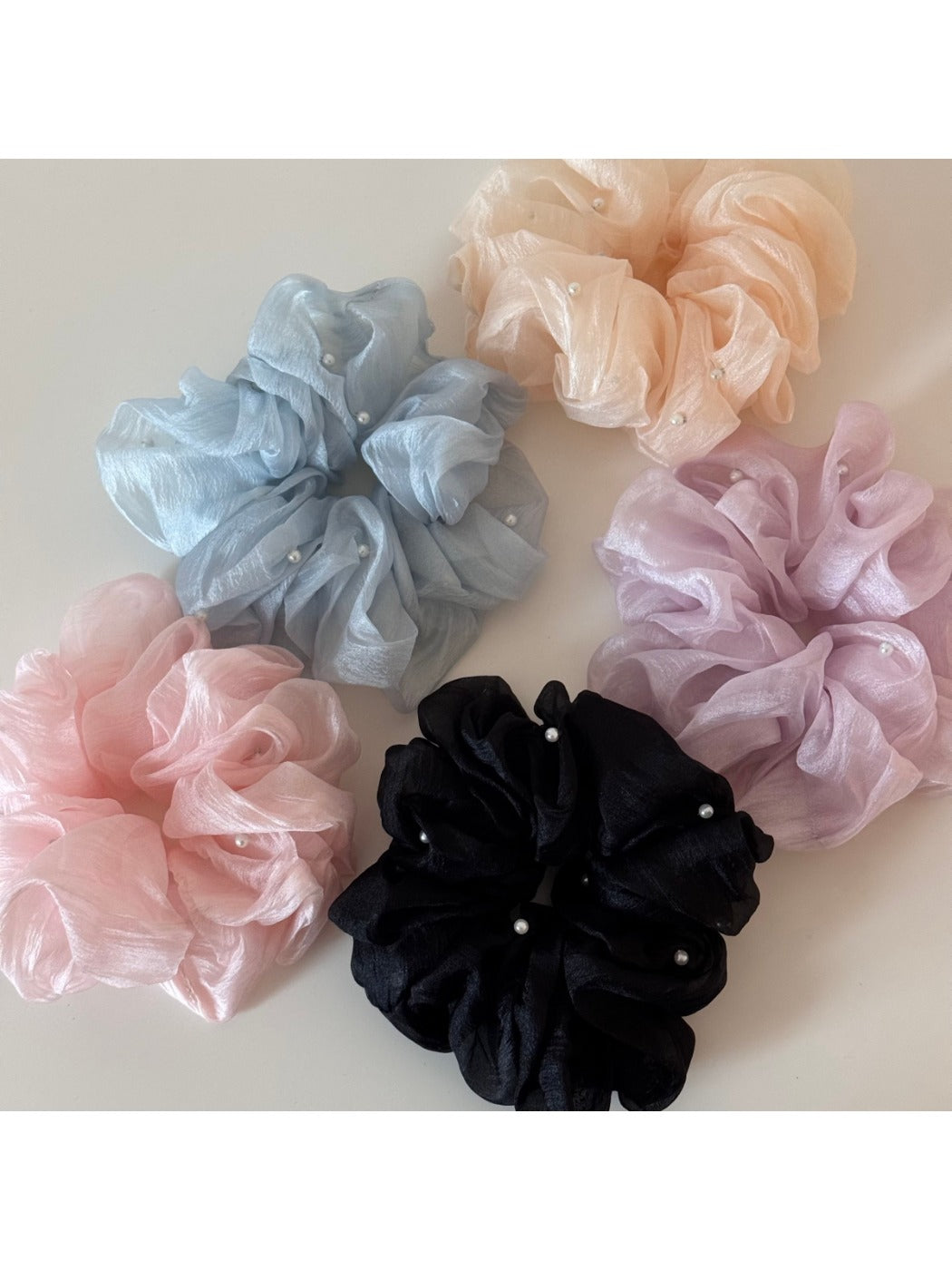 Gifty scrunchie styled in a ponytail on a model with casual outfit