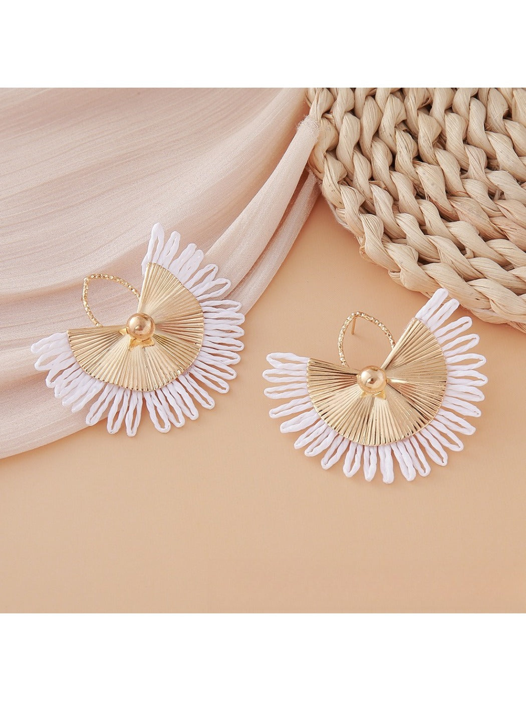 Earedge raffia woven fan shape earrings worn by model with short hair
