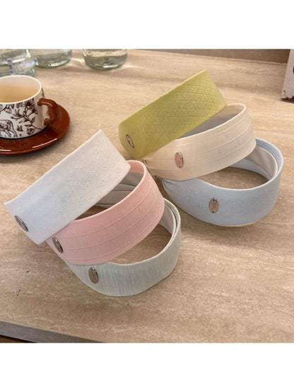 Close-up of Gifty wide solid color headband showing fabric texture
