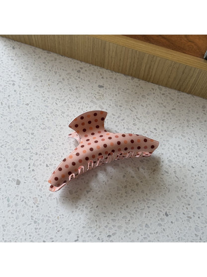 Top view of Beau polka dot claw clip showing clasp mechanism