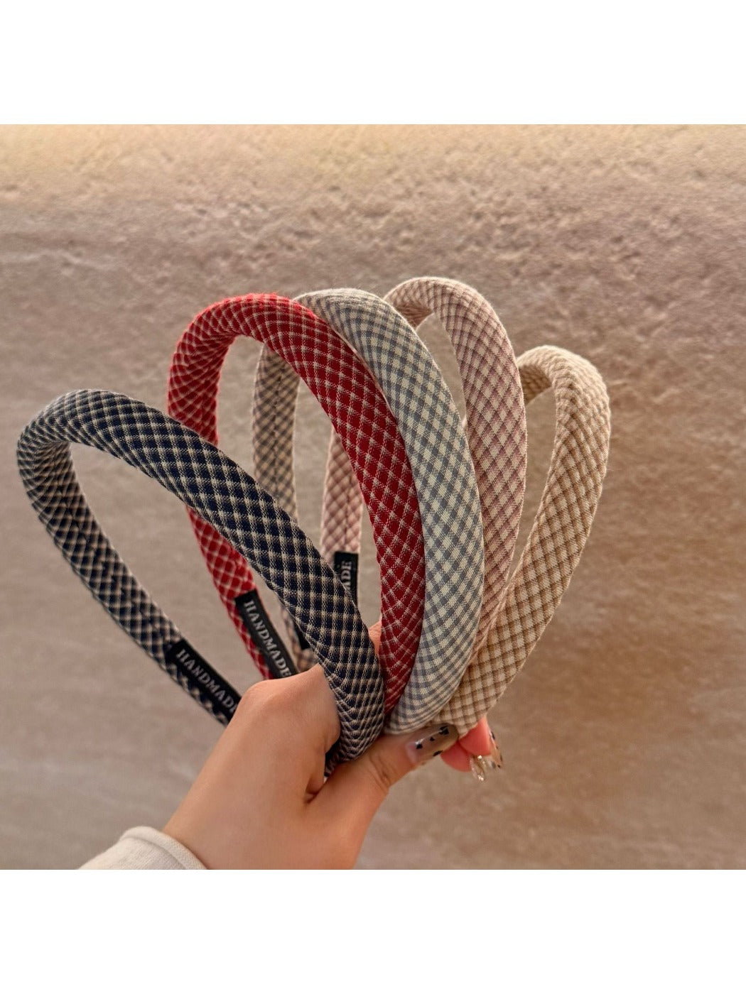 Gifty chic minimalist plaid headband in neutral tones displayed on a white background