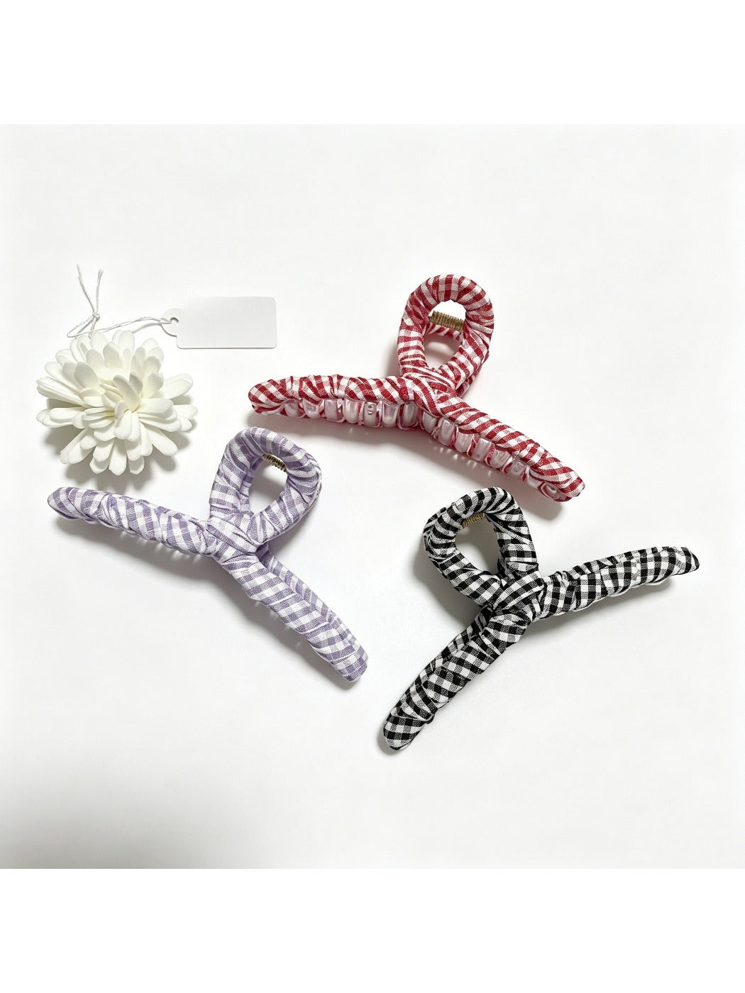 Close-up of Beau plaid fabric wrapped claw clip highlighting fabric texture