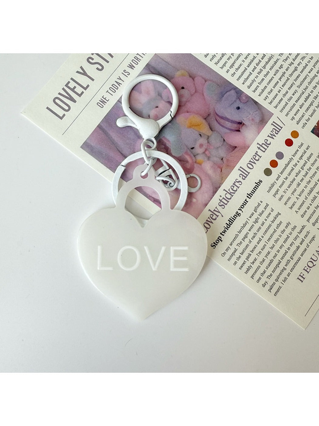 Solid color heart-shaped pendant keychain in black with silver keyring