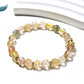 Lovra bracelet worn on wrist featuring vibrant multicolored crystal beads