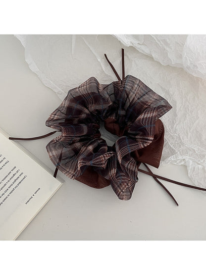 Close-up of Gifty vintage plaid tulle scrunchie showing texture and pattern details