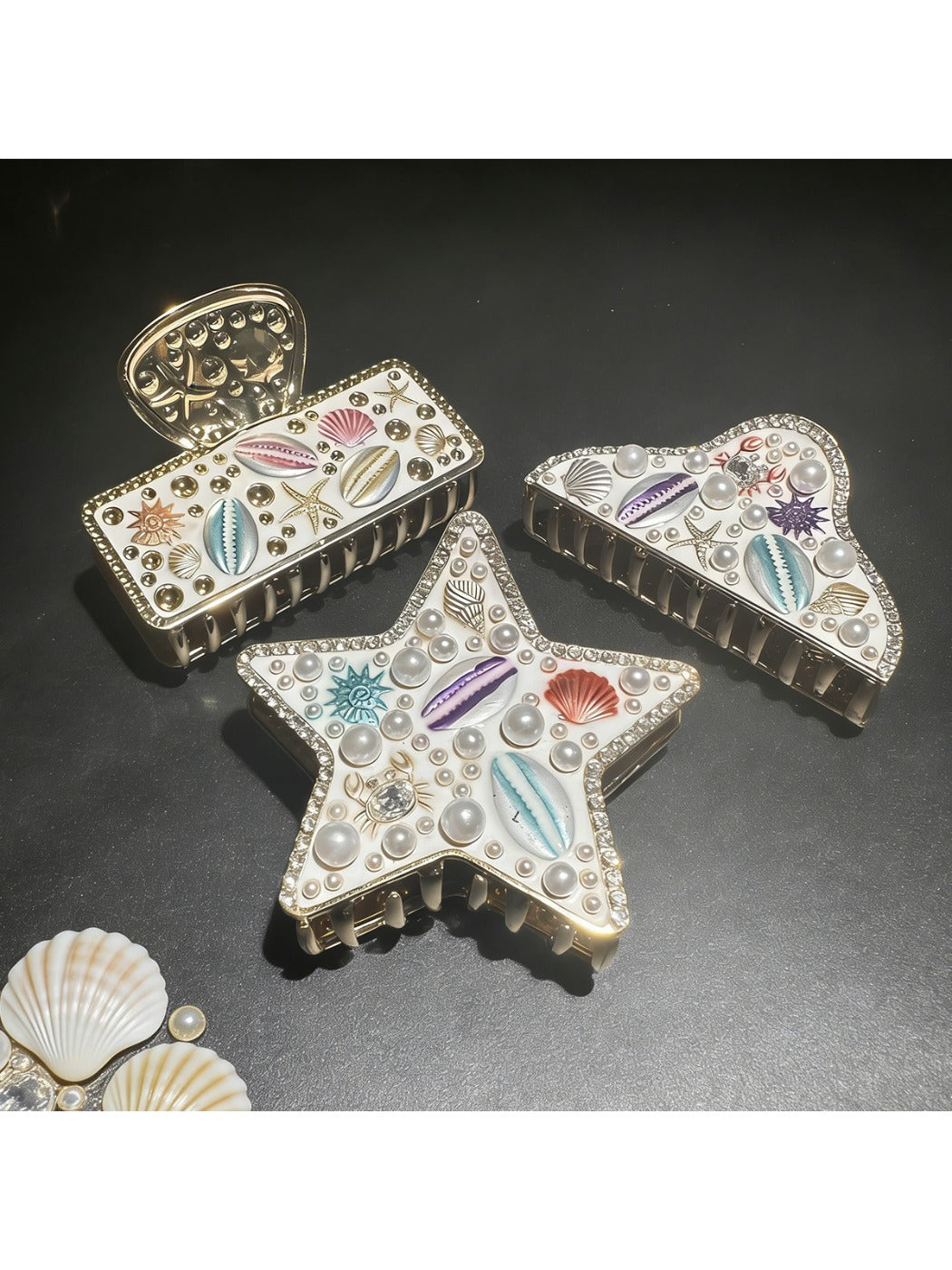 Close-up of Beau beach style artistic hair clip with seashell design on white background