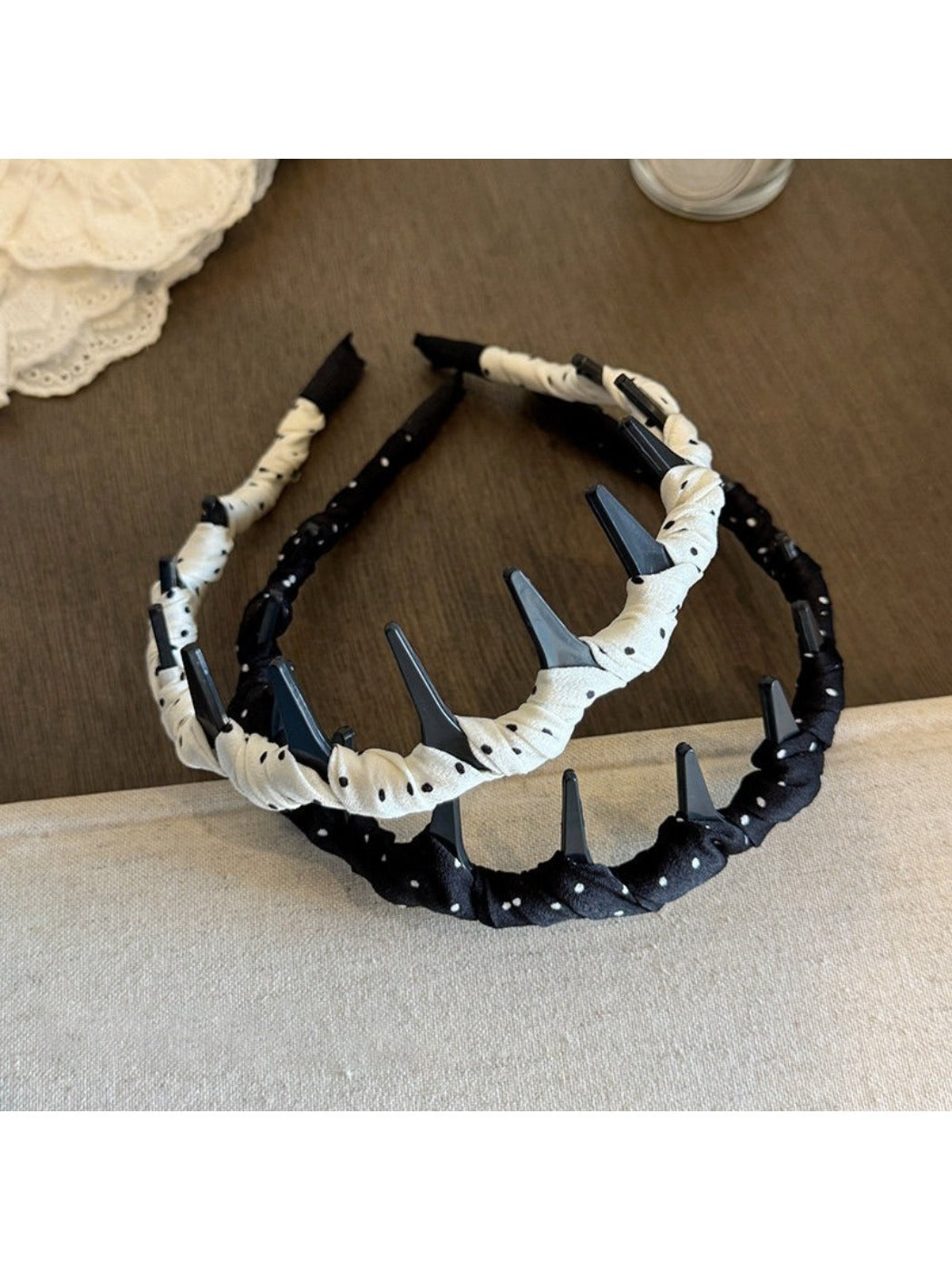 Close-up of Gifty polka dot headband fabric and pattern details