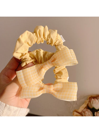Gifty hair tie with sweet bow detail displayed on a white background
