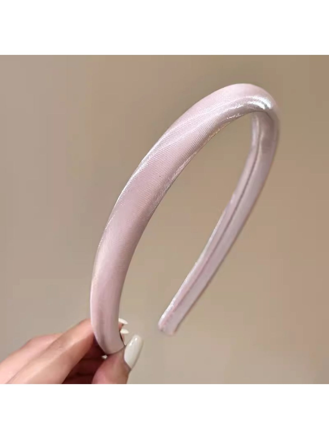 Smooth satin headband folded to highlight soft fabric and bright color