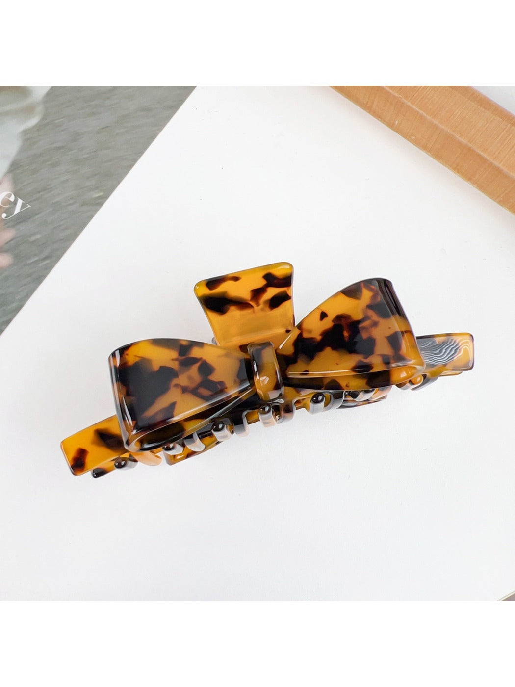 Beau minimalist bow claw clip shown from the back with clasp visible