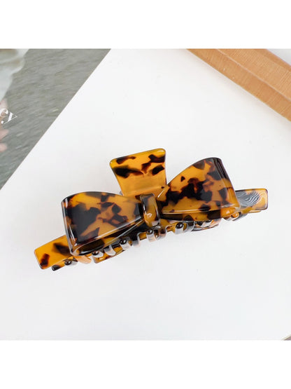 Beau minimalist bow claw clip shown from the back with clasp visible