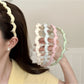 Gifty headband worn by model with wavy hair, showcasing fit and style