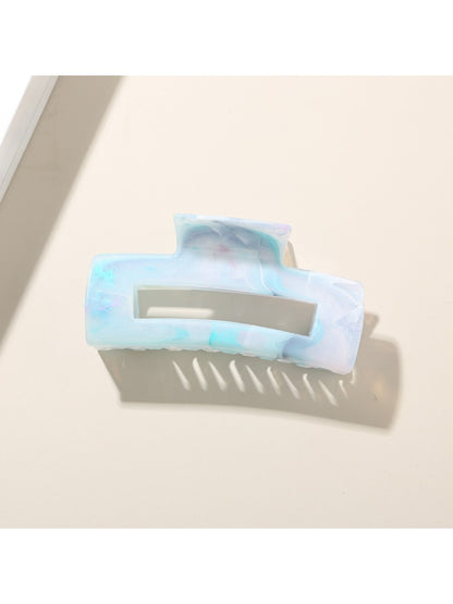 Beau hair clip next to matching accessories on a white background for styling inspiration