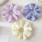Colorful scrunchie with a soft, gathered fabric design for casual wear