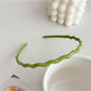 Gifty headband folded to show flexibility and wave shape