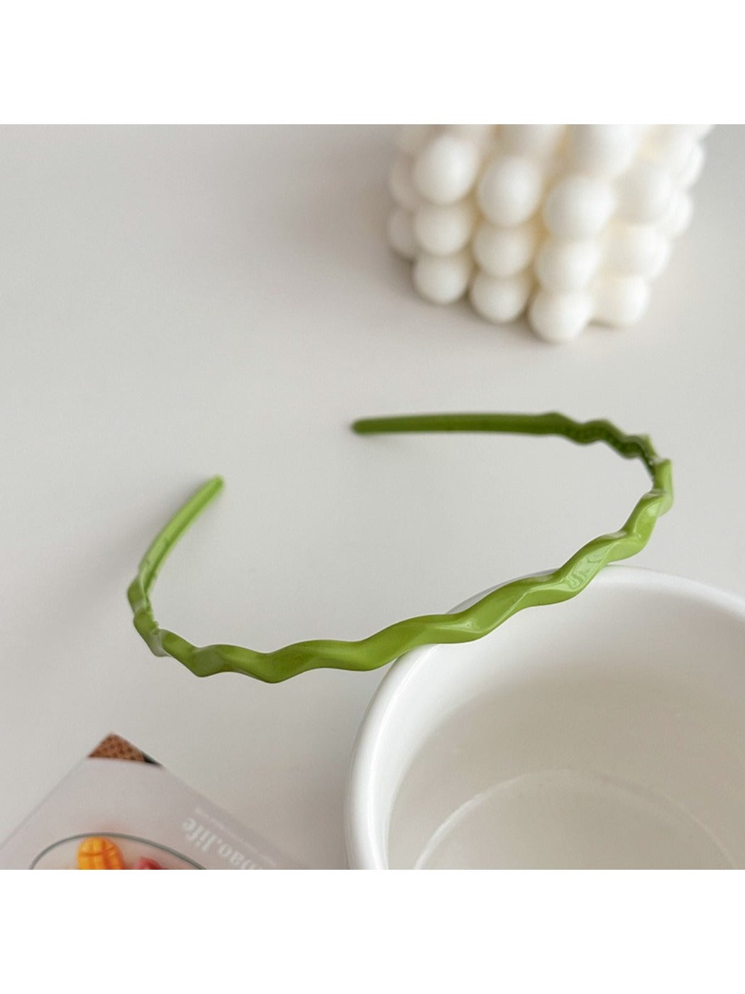 Gifty headband folded to show flexibility and wave shape