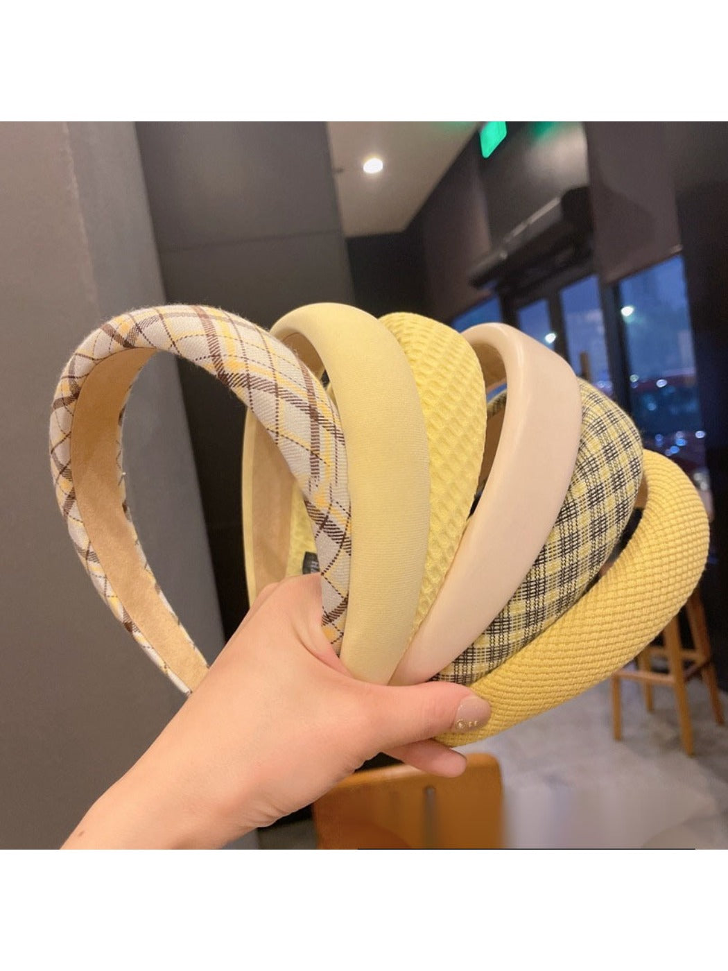 Sweet yellow style headband with a bow detail on a white background